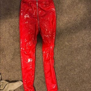 Red leather leggings, all around zipper